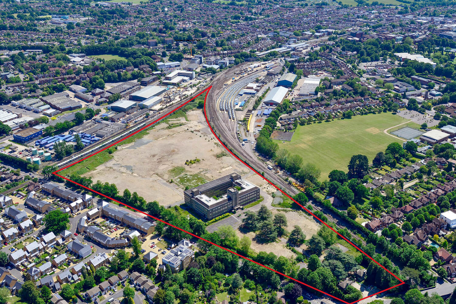 Aerial view of the site with a red line marking the site boundary